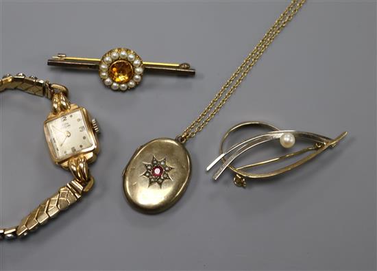 A ladys 18ct gold Dogma wrist watch, two brooches including 9ct gold and a yellow metal locket on a 9ct gold chain.